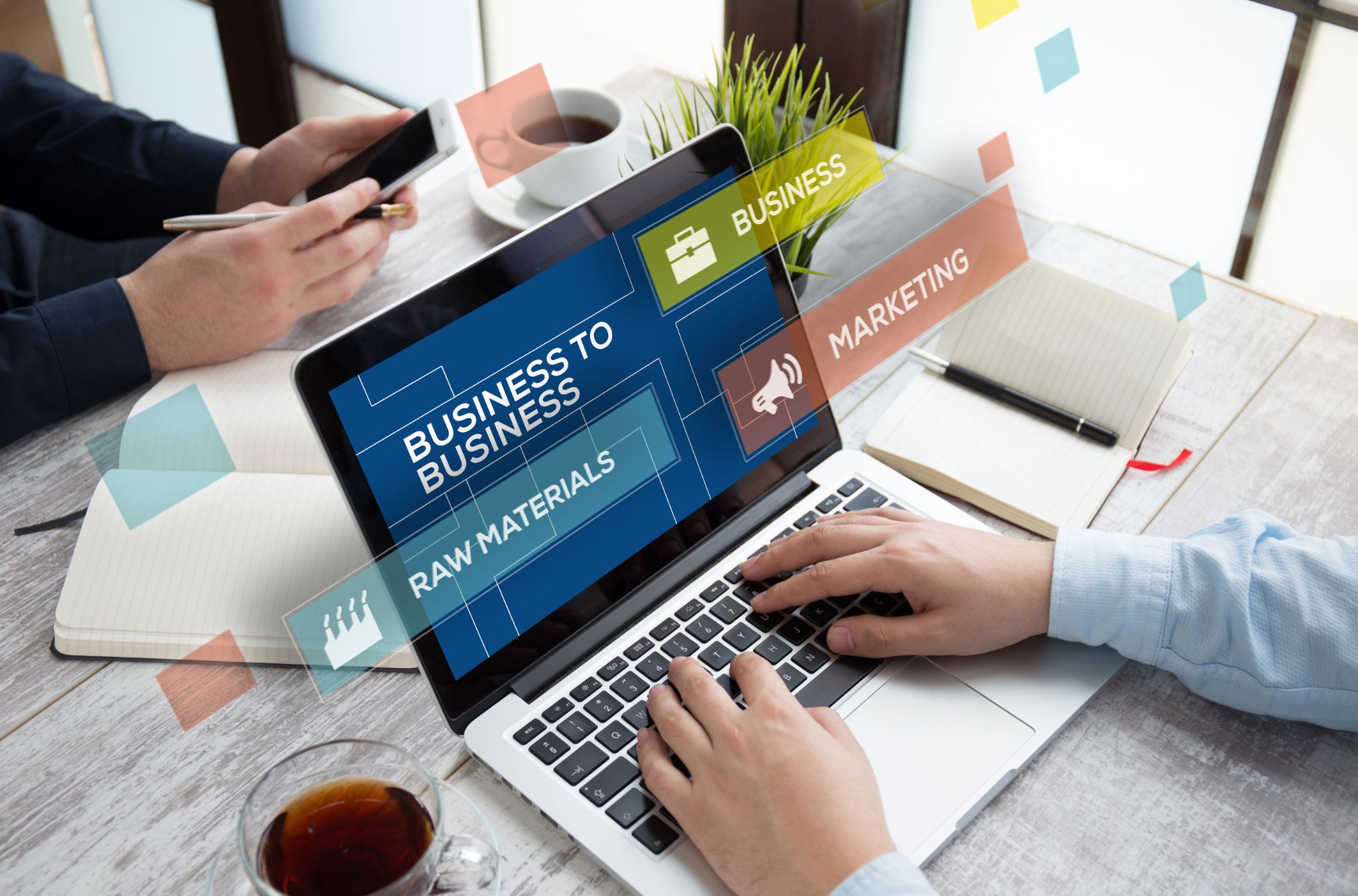 a guy using a laptop with a screen that says business to business